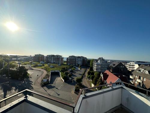 a view of a city from a balcony at Traumhafte Ferienwohnung "Seeperle" in Cuxhaven - Duhnen mit Teilseeblick in 1A Lage in Cuxhaven