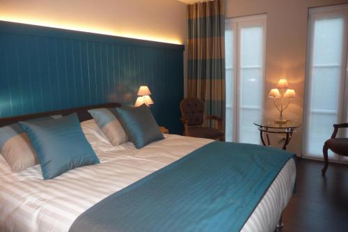 Ein Bett oder Betten in einem Zimmer der Unterkunft B&B Riche Terre