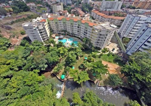 an aerial view of a city with buildings and trees at Thermas Paradise in Rio Quente