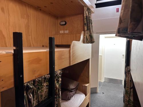 a bunk bed in a tiny house at Fox Glacier Jade Hotel in Fox Glacier