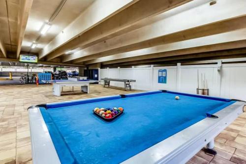 a pool table in a large room with at Your Ultimate Beachfront retreat! Brand New Flooring!! in Panama City Beach