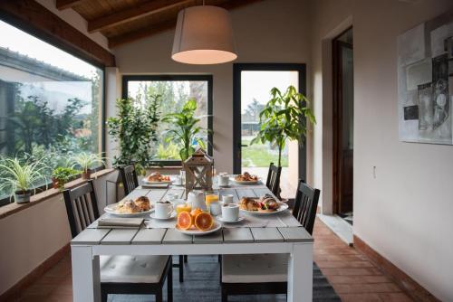 a table with plates of food on it at Il Casale Relais in San Giuliano Terme