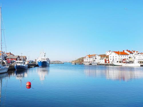 a group of boats docked in a harbor at 4 person holiday home in GRUNDSUND in Grundsund