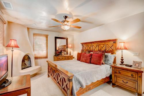 a bedroom with a bed and a ceiling fan at El Corazon de Santa Fe, 3 Bedrooms, Sleeps 6, Flat Panel TVs, Fireplaces in Santa Fe