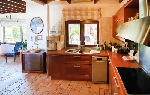 a kitchen with a sink and a counter top at Pet Friendly Home In Kiato With Sauna in Kiáton