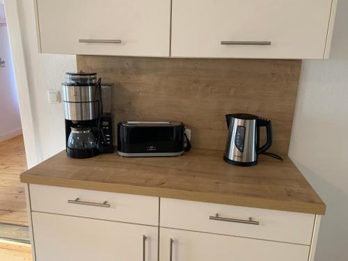 a kitchen counter with a coffee maker and a toaster at Gemütlichkeit im Fachwerkhaus, 3 Schlafzimmer, Balkon, Parkplatz in Wolfhagen