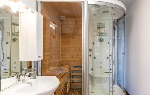 a bathroom with a sink and a shower at Nice Home In Tucepi With 3 Bedrooms, Sauna And Wifi in Tučepi