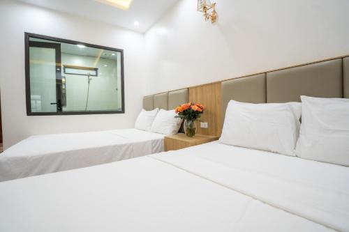 Ένα ή περισσότερα κρεβάτια σε δωμάτιο στο Vsana Vu Son Hotel