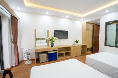 Ένα ή περισσότερα κρεβάτια σε δωμάτιο στο Vsana Vu Son Hotel