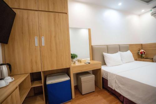Ένα ή περισσότερα κρεβάτια σε δωμάτιο στο Vsana Vu Son Hotel