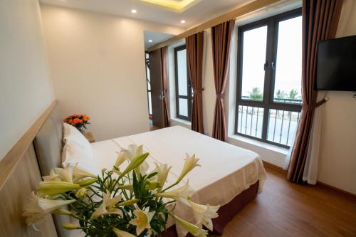 Ένα ή περισσότερα κρεβάτια σε δωμάτιο στο Vsana Vu Son Hotel