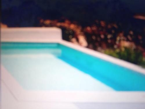 a close up of a swimming pool at HOUSE 3Bedroom Maisonette ΕΞΟΧΙΚΟ Alyki PAROS 50m from BEACH ideal for families in Aliki