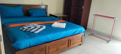 Ένα ή περισσότερα κρεβάτια σε δωμάτιο στο Golo Tango Homestay