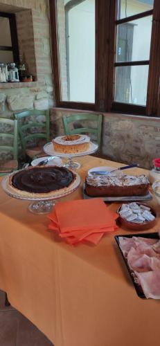a table with several cakes on top of it at Podere Ripabianca in Riparbella