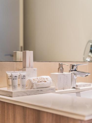 a bathroom sink with towels and a mirror at Chic 1BR in Park Heights 2 - Dubai Hills in Dubai