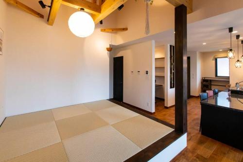 a kitchen and living room with a tile floor at The Villa Miyako in Hirara