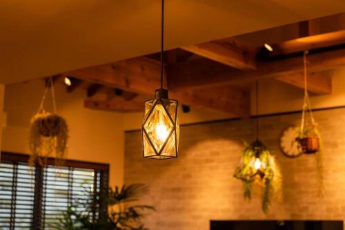 a room with two lights hanging from the ceiling at The Villa Miyako in Hirara