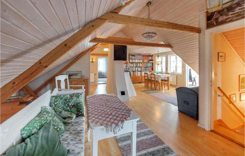 a living room and dining room in a house at Nice Home In Markaryd With Wifi in Markaryd