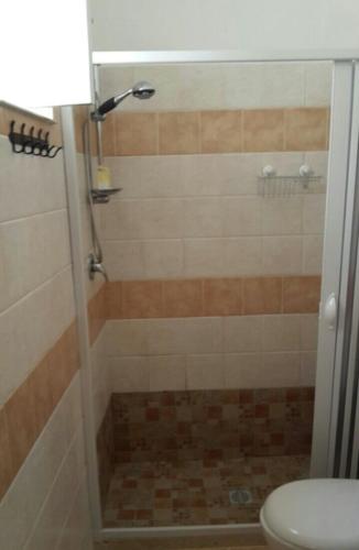 a bathroom with a shower with a toilet at Favignana KasAle in Favignana