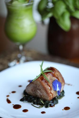 a white plate with a piece of food on a table at Mandala Spa & Resort Villas in Boracay