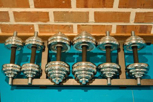 a bunch of glass domidated lights on a wall at Kosh Havuz boutique hotel in Samarkand