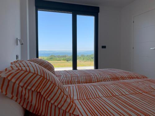 Postel nebo postele na pokoji v ubytování Casa Leiras