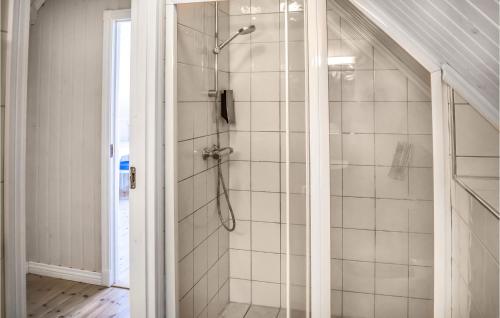 a shower with a glass door in a bathroom at 3 Bedroom Nice Home In Holmsbu in Holmsbu