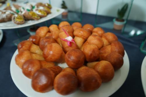 a plate of hot dogs on a table at Hotel Parco Delle Agavi in Ischia
