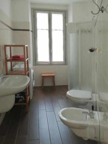 a bathroom with two sinks and a toilet at Al Molo 2 in Como