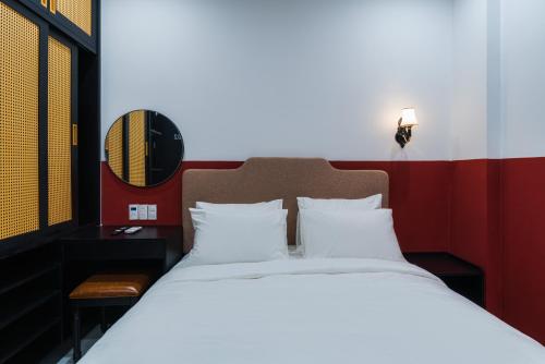 Ένα ή περισσότερα κρεβάτια σε δωμάτιο στο Q Boutique Hotel