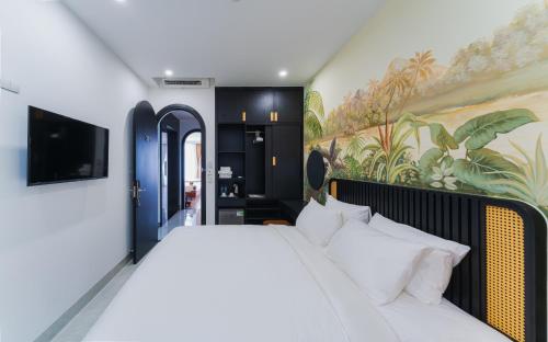 Ένα ή περισσότερα κρεβάτια σε δωμάτιο στο Q Boutique Hotel