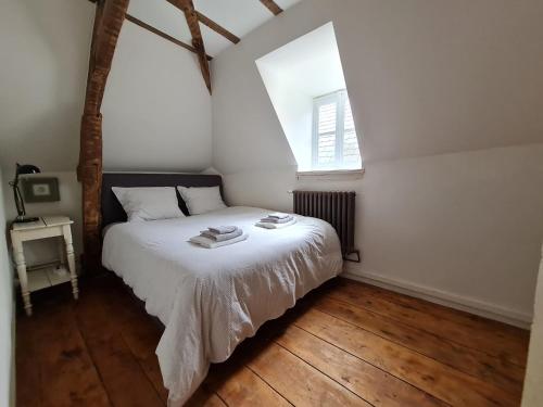 Ένα ή περισσότερα κρεβάτια σε δωμάτιο στο Château de Paraize