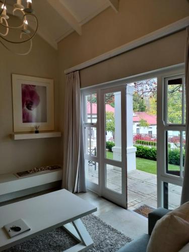 Ένα ή περισσότερα κρεβάτια σε δωμάτιο στο Homestead Villas