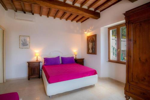 Postel nebo postele na pokoji v ubytování Villa Porticciolo