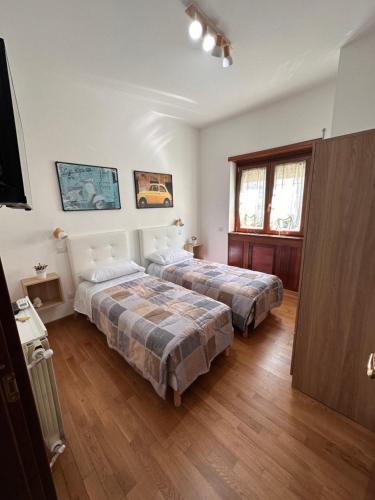 Posteľ alebo postele v izbe v ubytovaní Casa Roma Fiorita