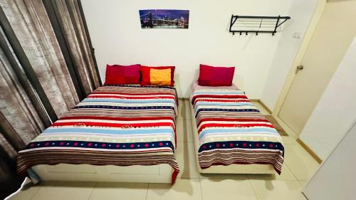 Кровать или кровати в номере Vista Alam Roomstay Homestay