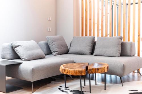 a living room with a couch and a table at Ca' del magu in San Michele Mondovì