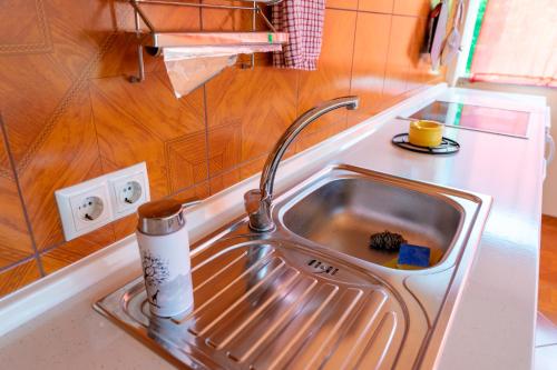 a stainless steel sink in a small kitchen at Apartments MoonRiver 
