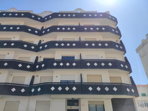 a building with a black and white building at Brisa do Mar in Vagos