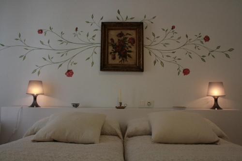 Posteľ alebo postele v izbe v ubytovaní Apartamentos La Casa Pintada