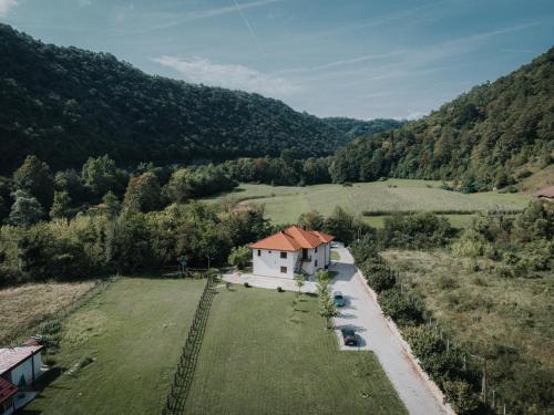 an aerial view of a house in a field at Apartments MoonRiver in Bihać
