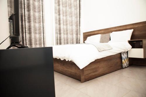 Voodi või voodid majutusasutuse KIGALI VILLa toas
