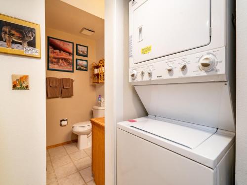 a white refrigerator in a bathroom with a toilet at Cielo Grande 305, 2 Bedrooms, HDTV, Pet Friendly, Sleeps 6 in Santa Fe
