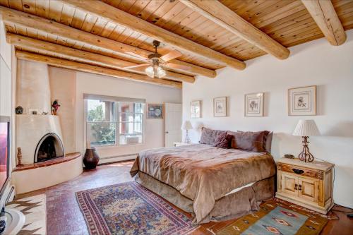a bedroom with a bed and a fireplace at Moonstar, 4 Bedrooms, Sleeps 10, Pet Friendly, Fireplace, Views, WiFi in Santa Fe