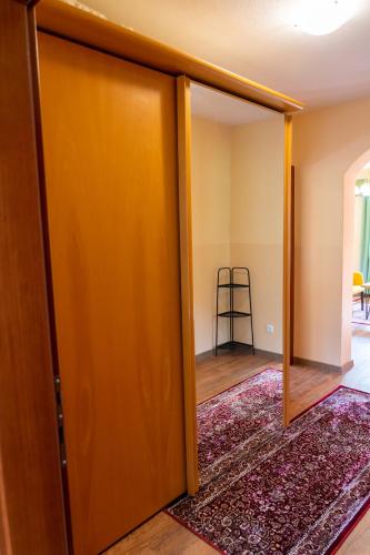 an open door in a room with a rug at Apartments MoonRiver in Bihać