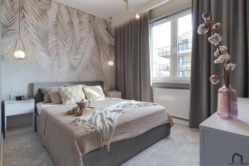 Posteľ alebo postele v izbe v ubytovaní Apartament Topo - Puck, ulica Nowy Swiat 23C