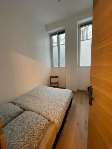 Säng eller sängar i ett rum på Appartement paris 16 eme