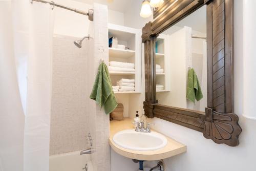 a bathroom with a sink and a mirror at Gomez Gardens, 2 Bedrooms, Sleeps 4 in Santa Fe
