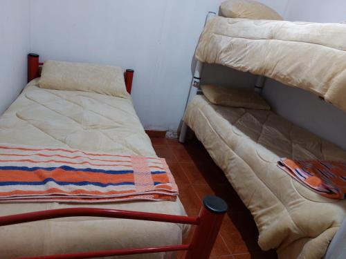 a room with two bunk beds and a couch at rancho de los bellidos in Perico