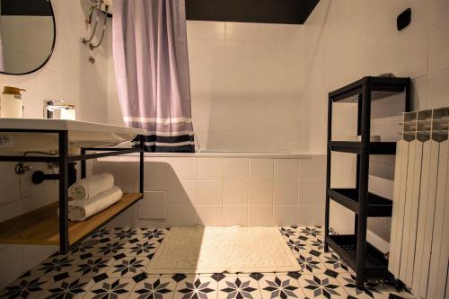 a bathroom with a sink and a bath tub at Modern oasis apartment Split PRIVATE PARKING in Split
